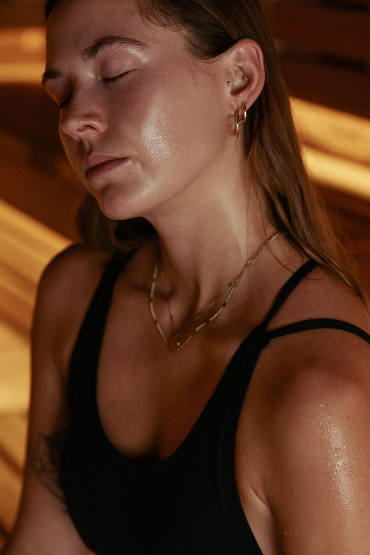 woman sweating in a sauna