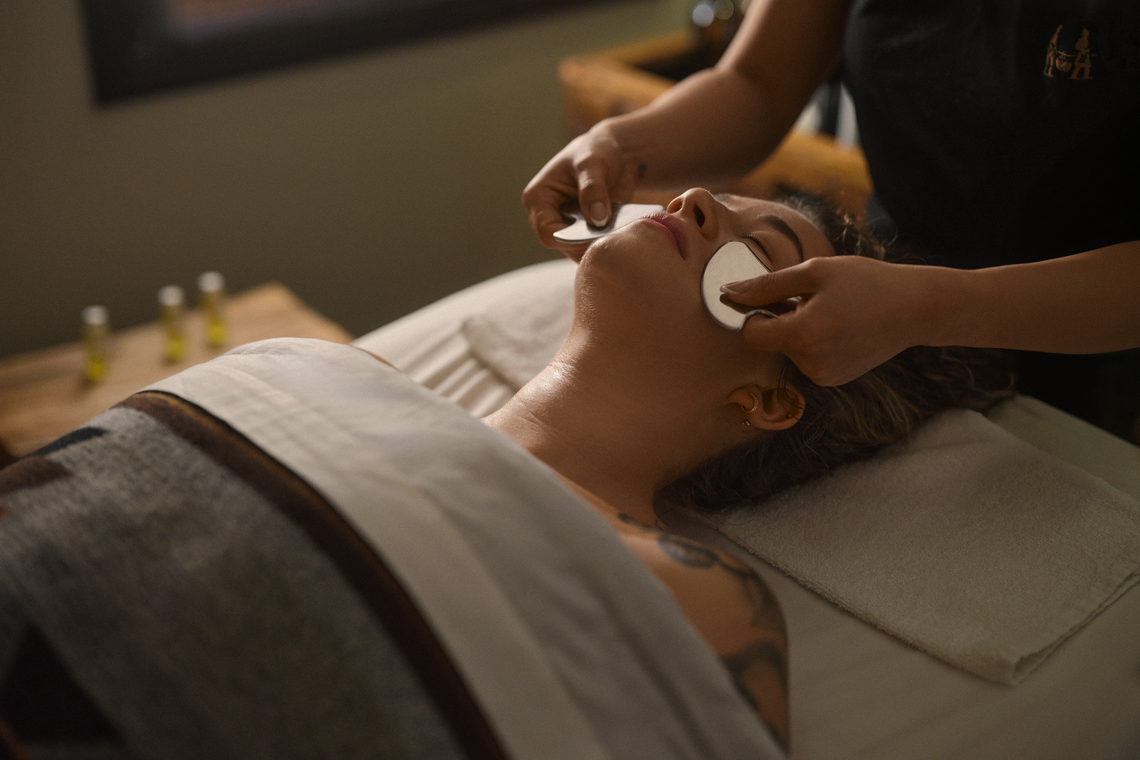 guest laying on her front receiving a massage