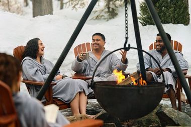 guests around a fire cauldron