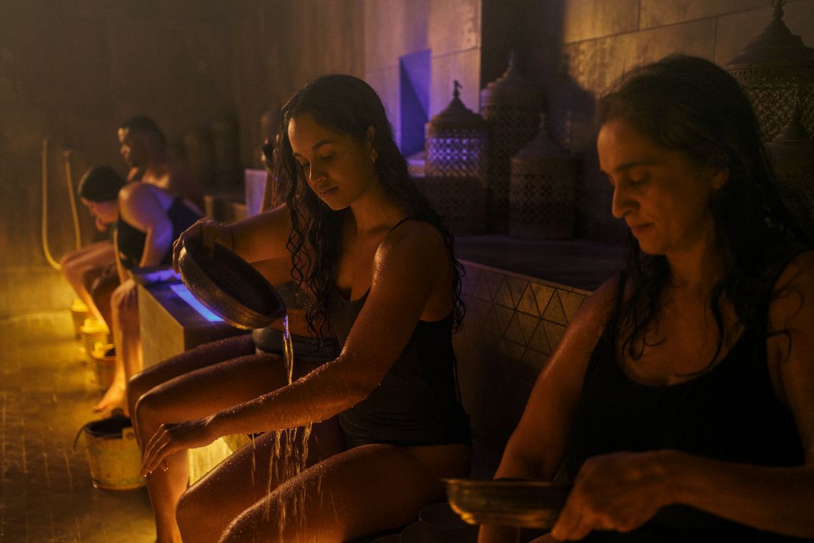 guests cleaning off the Rhassoul clay off their skin