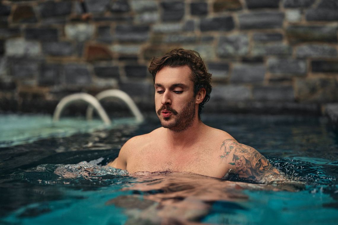 man doing a cold plunge