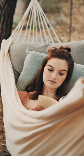 woman reading in hammock