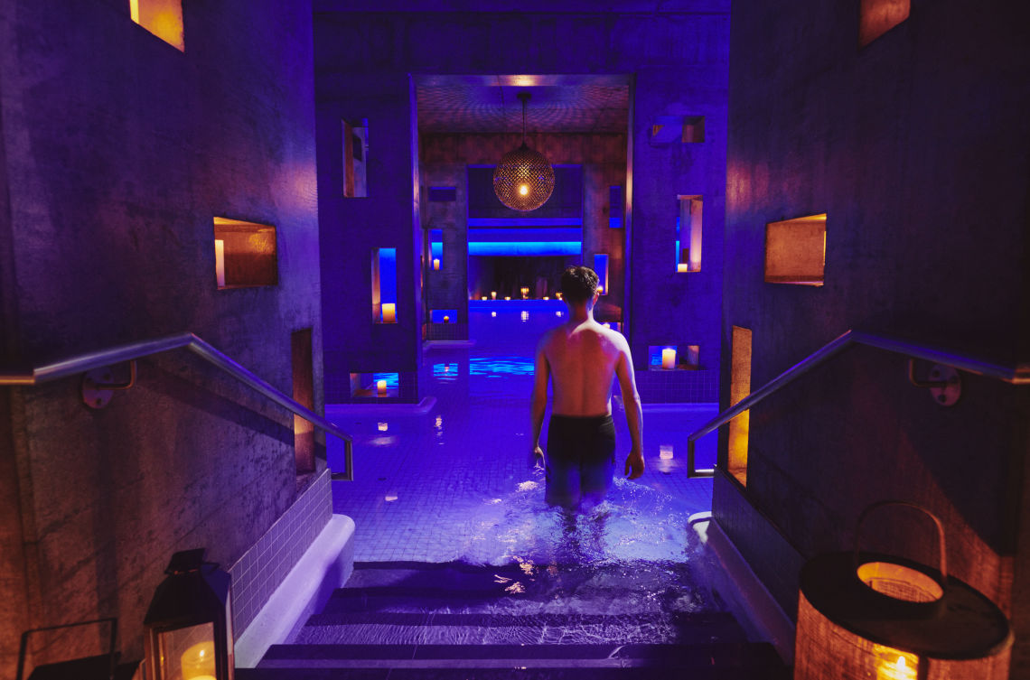 guest entering the epsom salt flotation pool