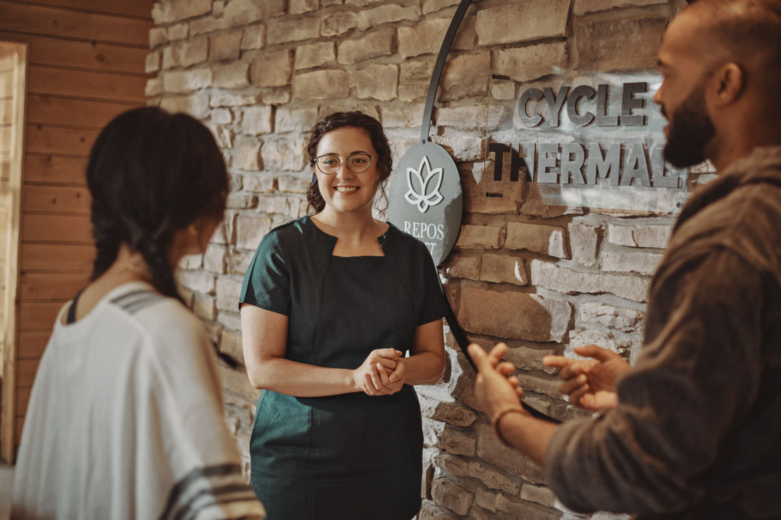 employee assisting spa guests