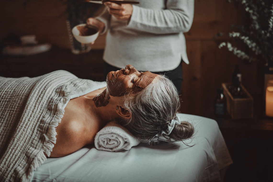 woman with a clay face mask