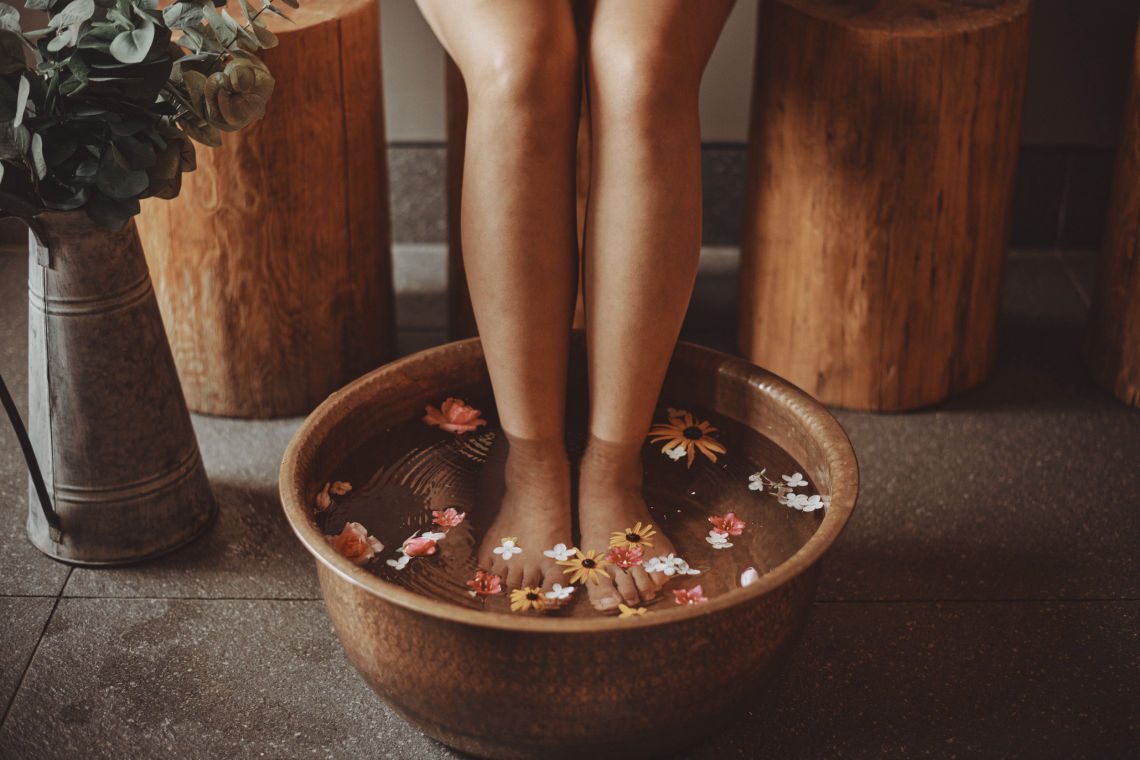feet in aromatherapy care basin