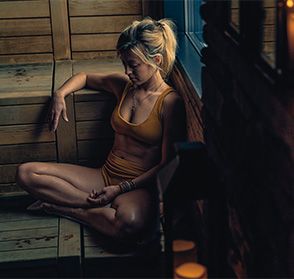 guest sitting in a sauna