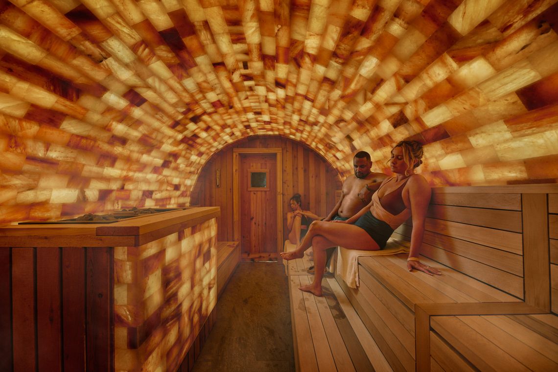 couple sitting in the halo himalayan salt sauna