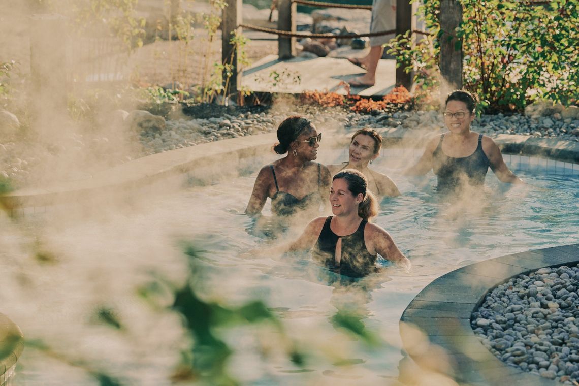 group of women in an outdoor thermal bath