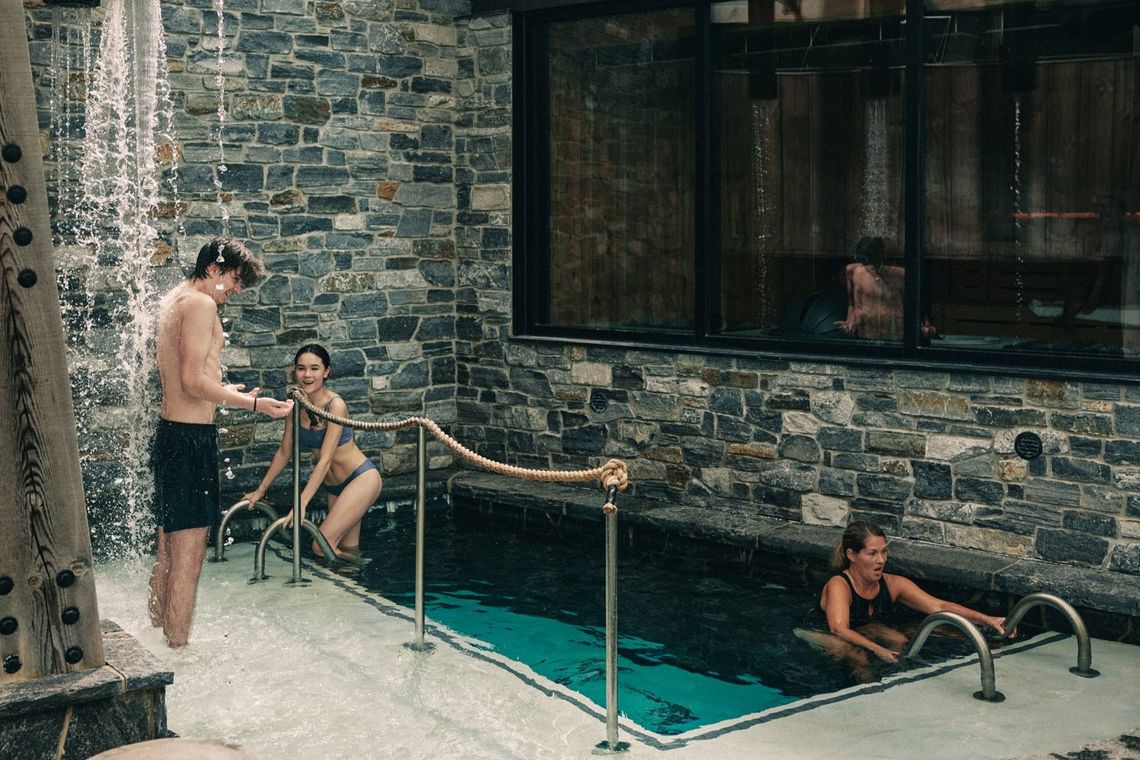 three guests doing a cold plunge