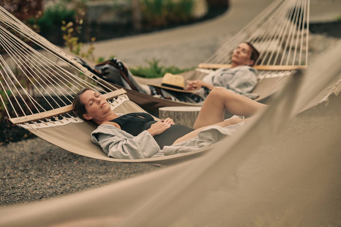 women relaxing in hammocks