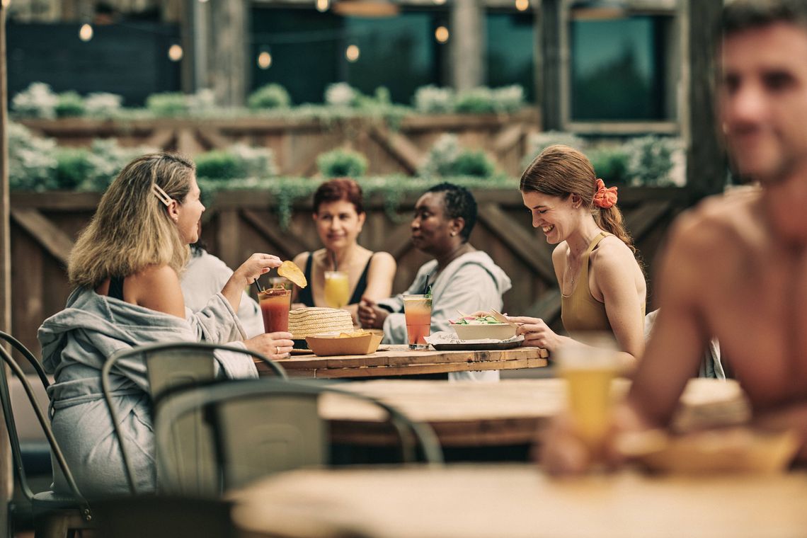 guests having a drink and a bite in the biergarden