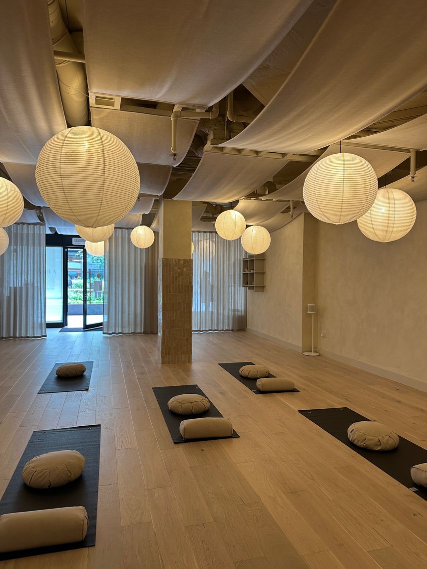 inside a yoga studio with floating lights