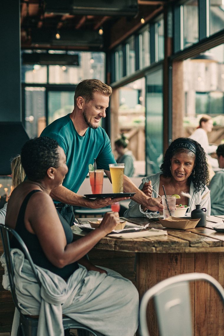 artisan serving drinks to guests