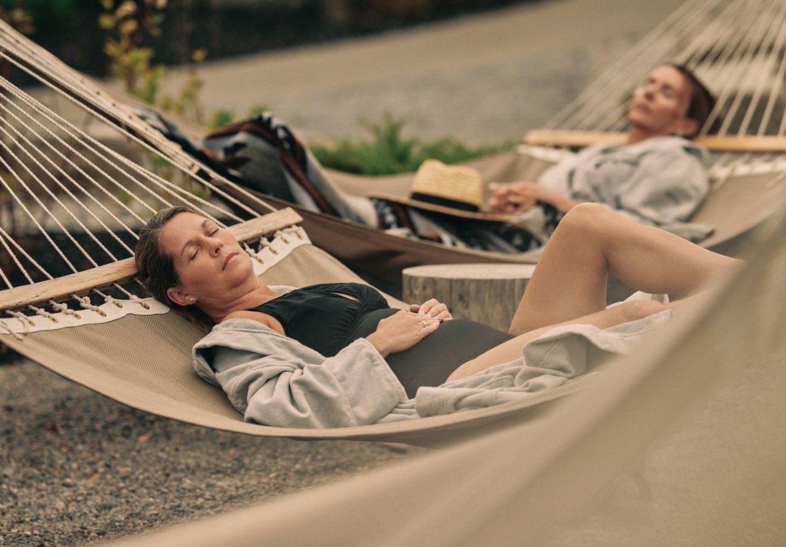 women resting in a hammock