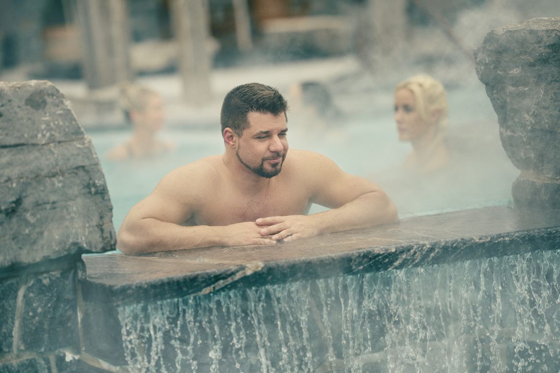 man relaxing in a thermal bath