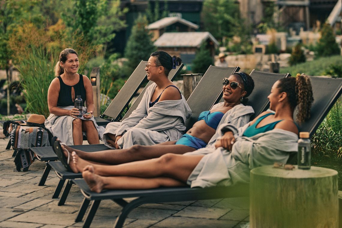 guests discussing on lounging chairs at the spa