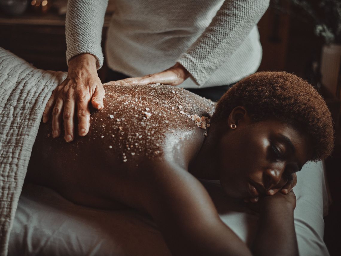 woman enjoying a salt scrub