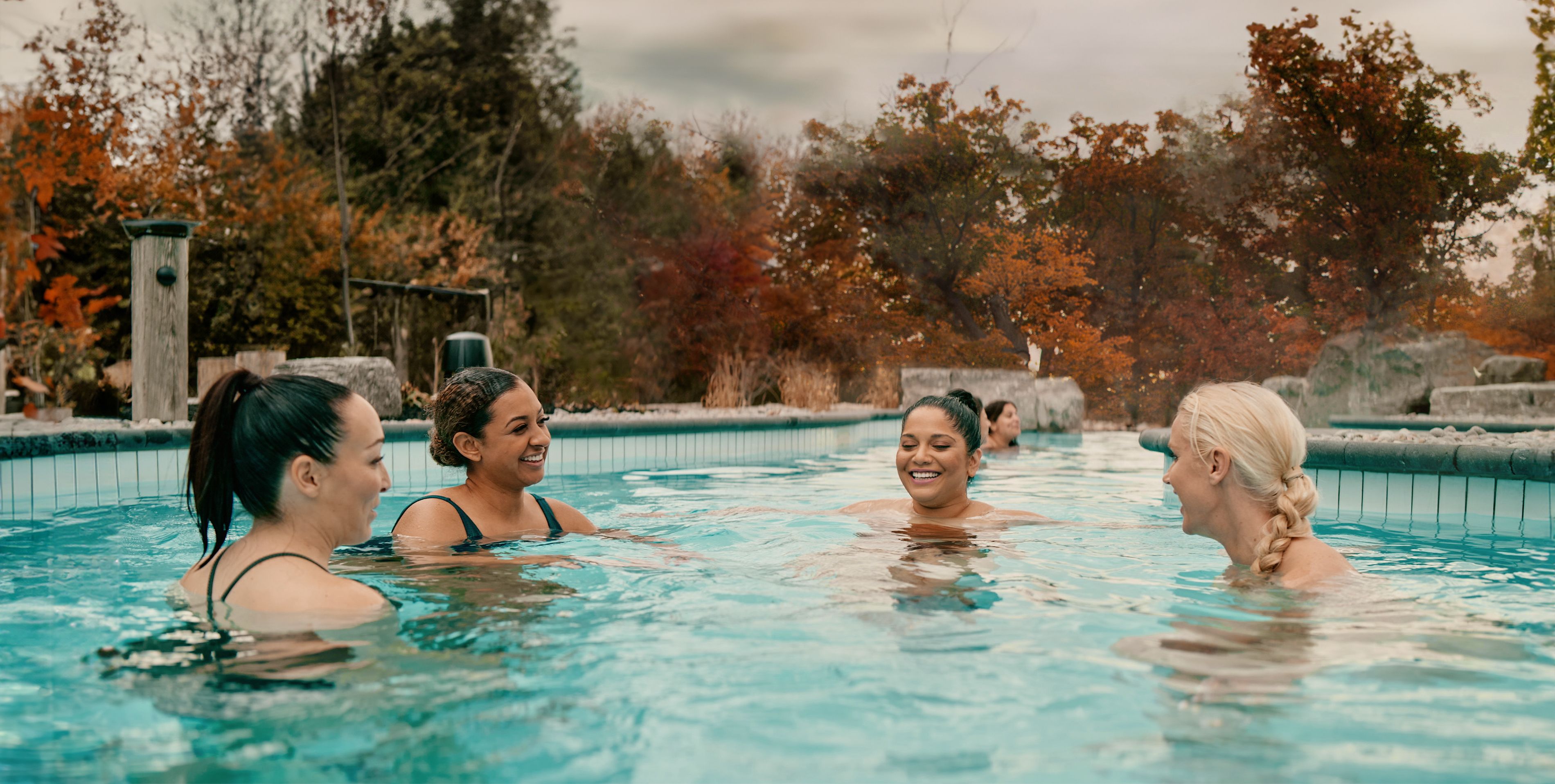 women in a bath during the fall season