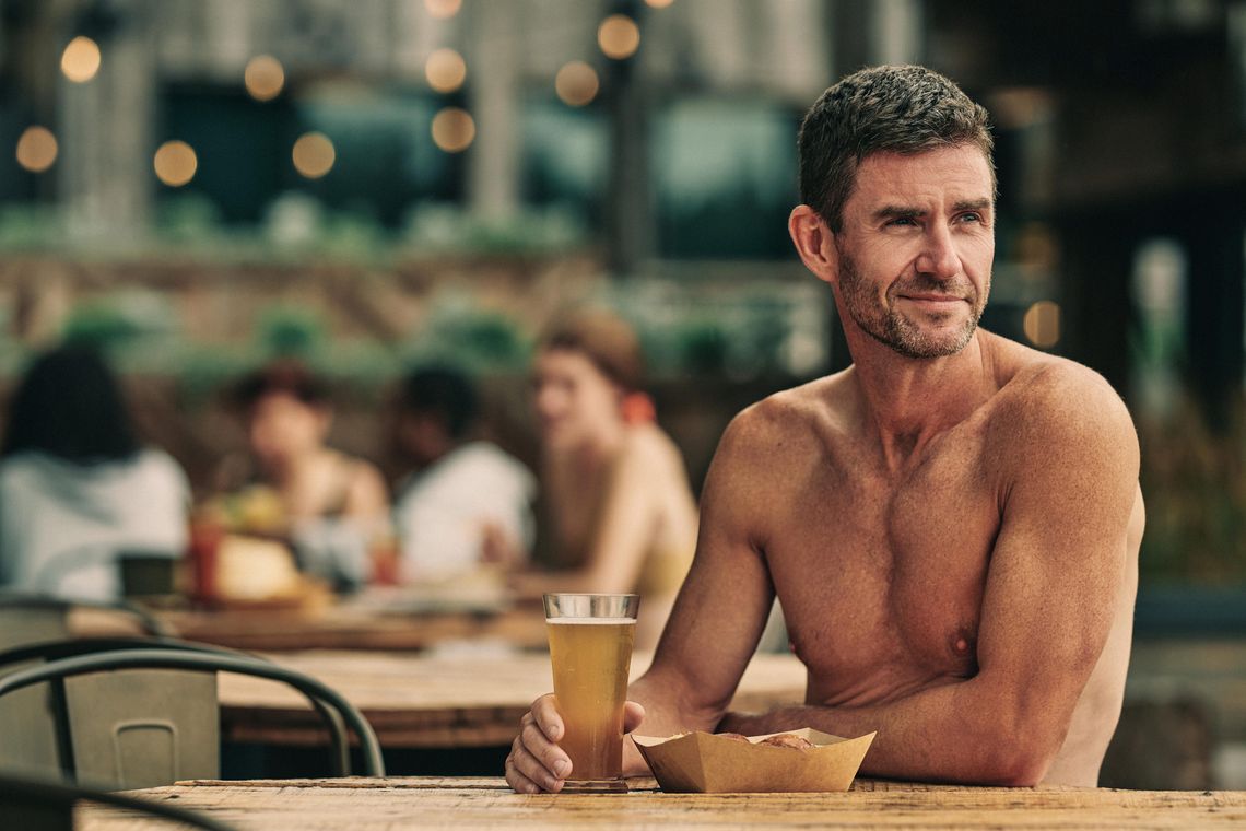 man with a drink at the Biergarden