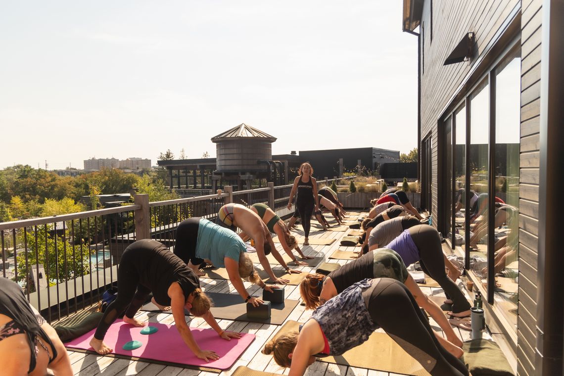 instructor teaching a yoga class at the spa