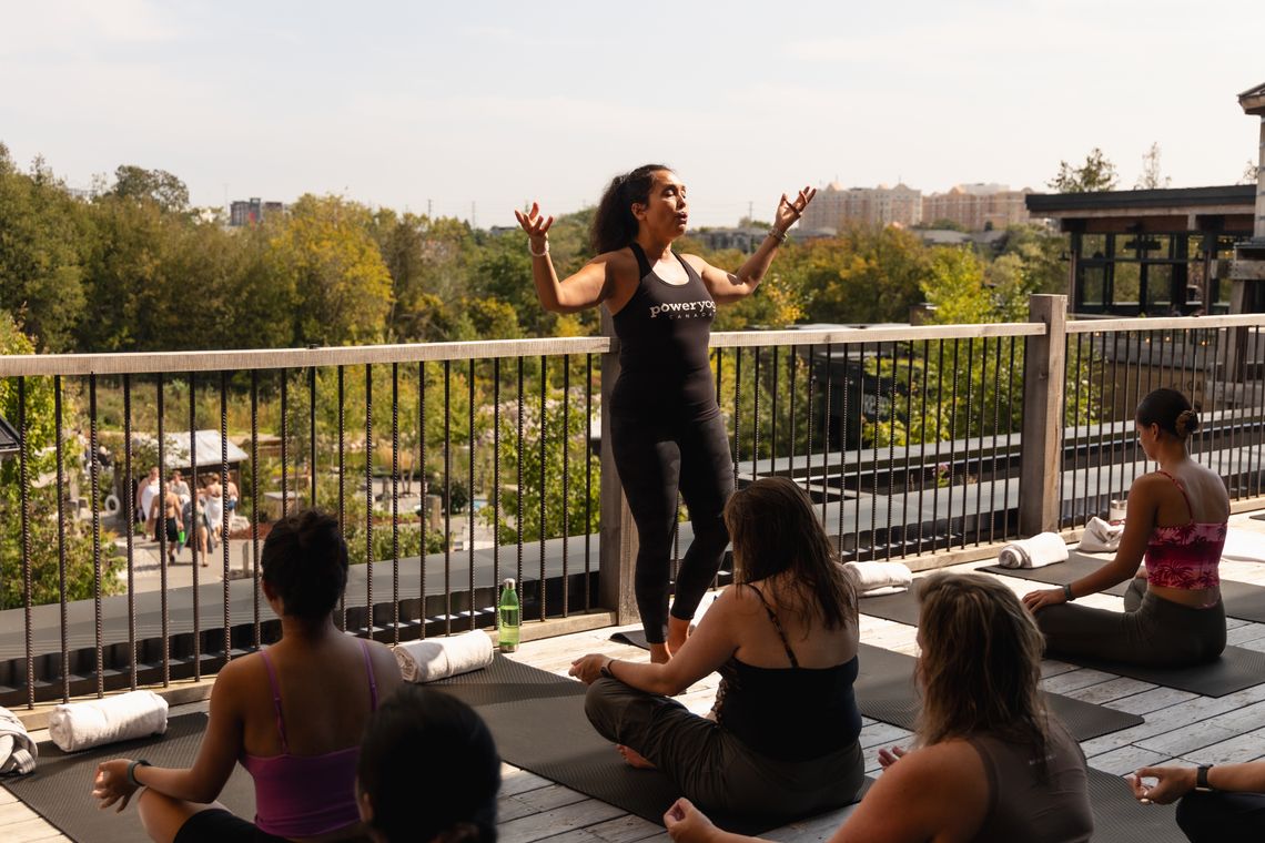 instructor teaching a yoga class at the spa