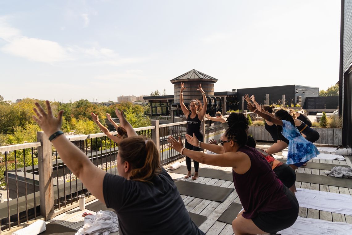 instructor teaching a yoga class at the spa