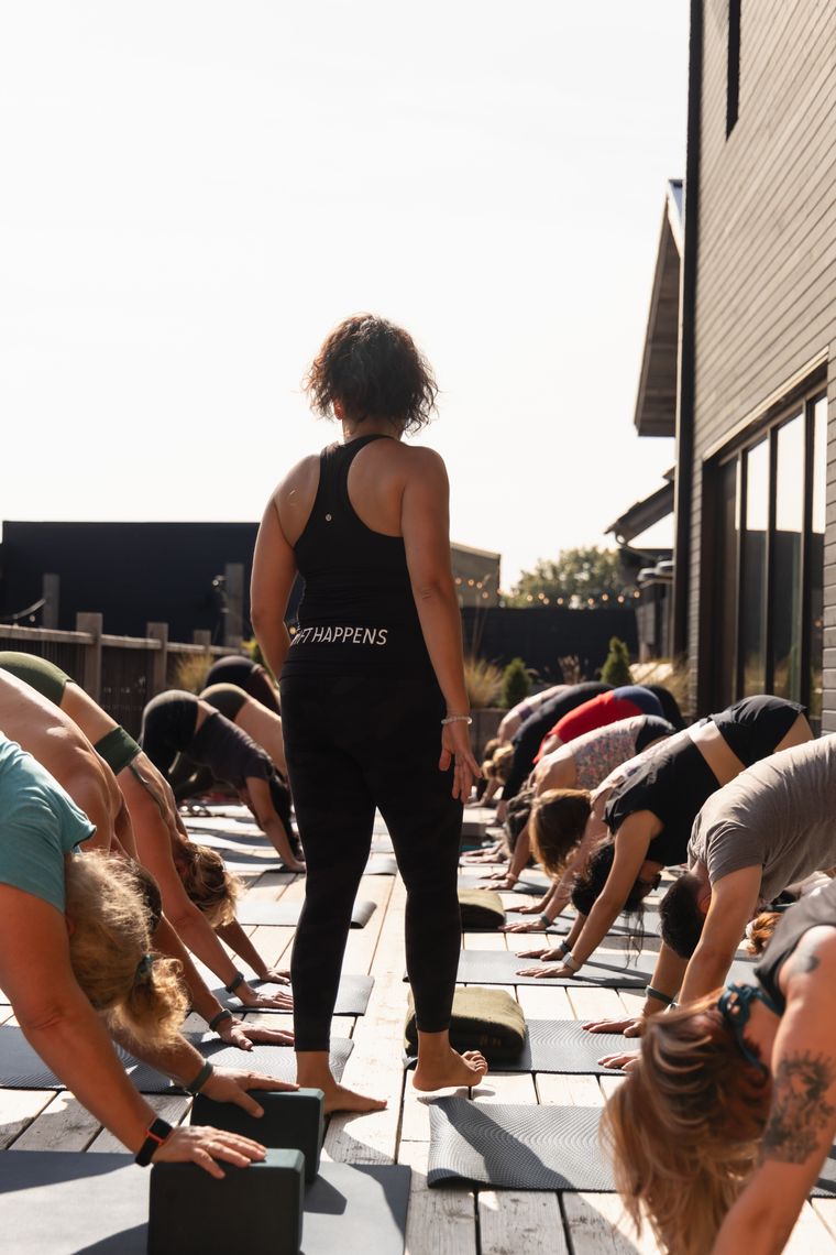 instructor hosting a yoga class at the spa