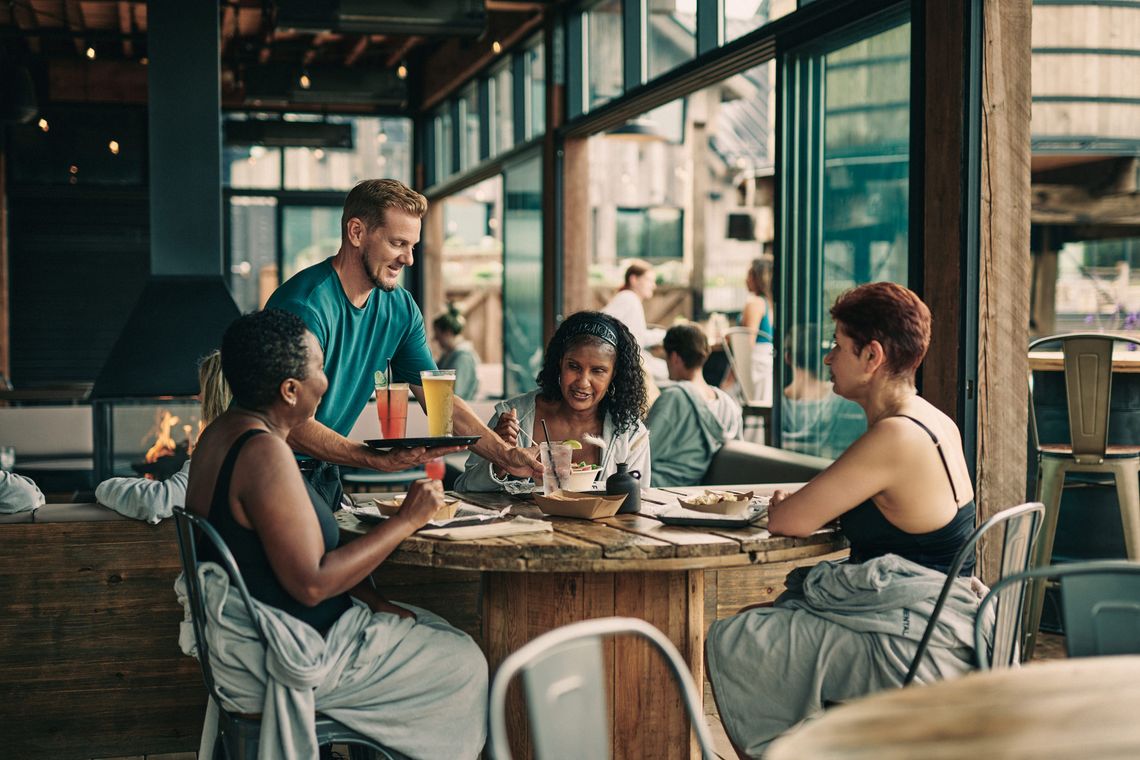 artisan serving drinks to guests