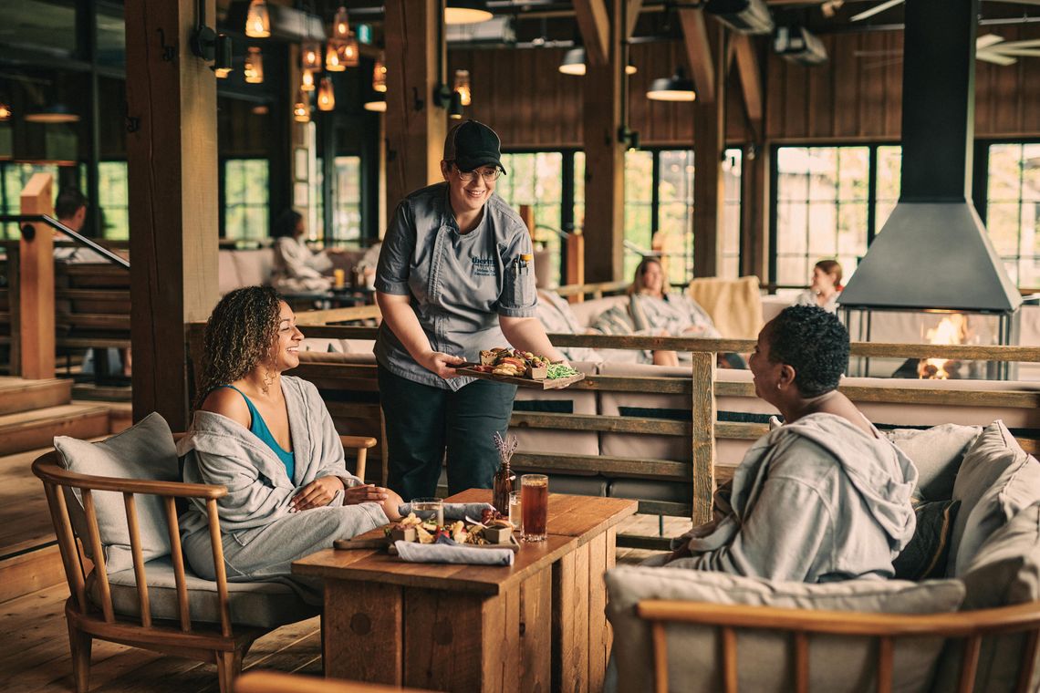 Chef serving meals to guests