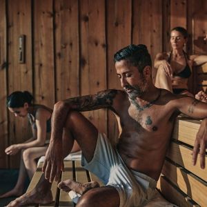 guests sitting in a sauna