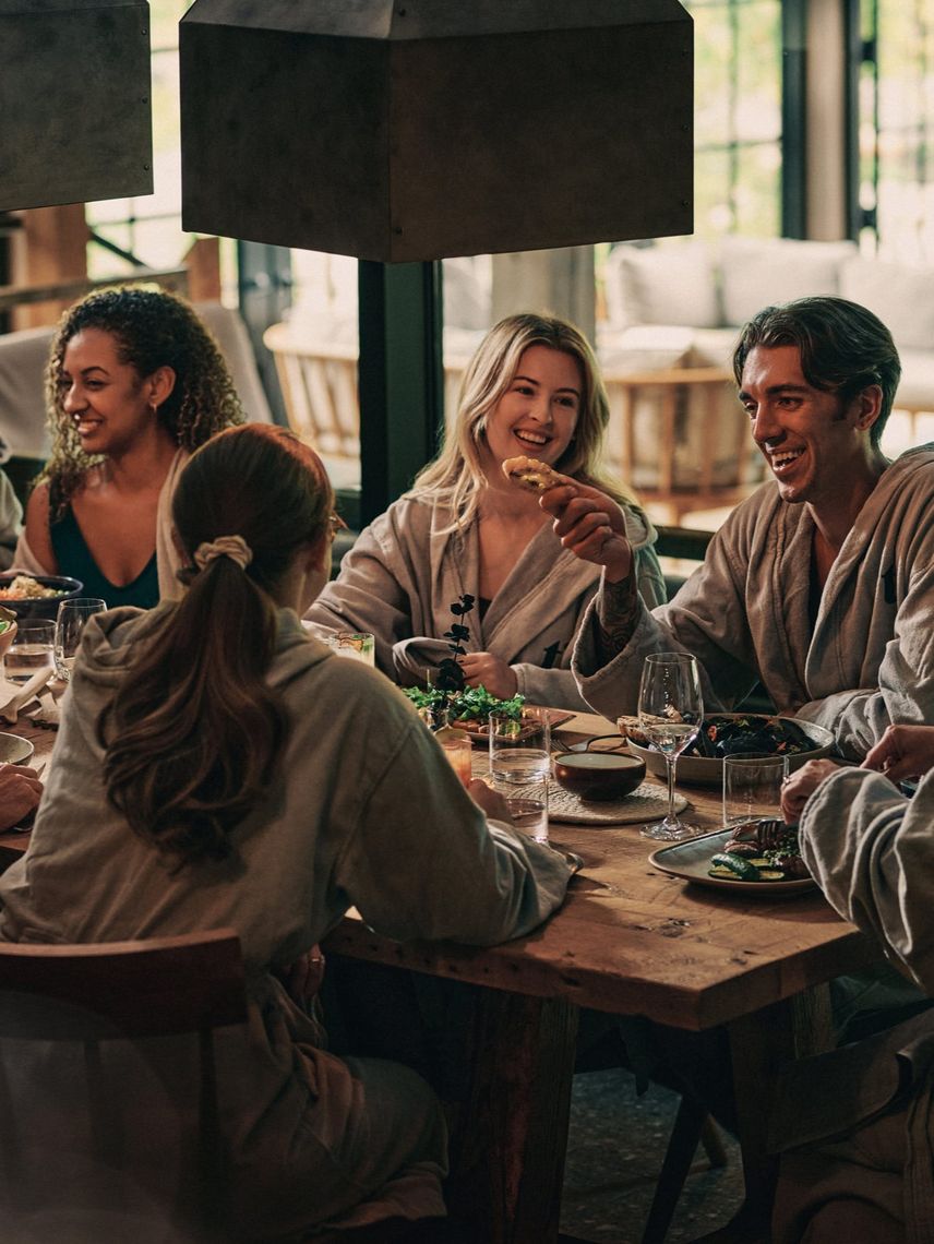 guests around a table at Le Resto