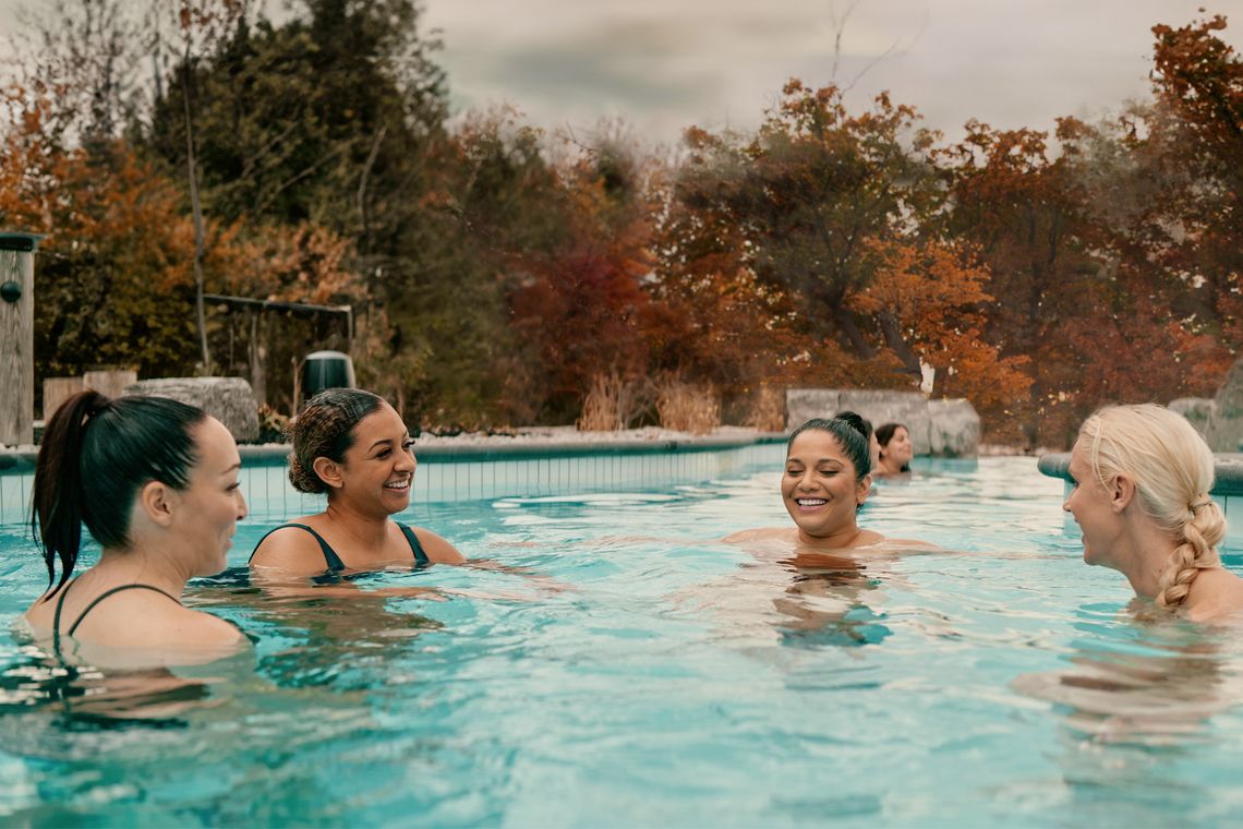 guests in a hot bath during fall season