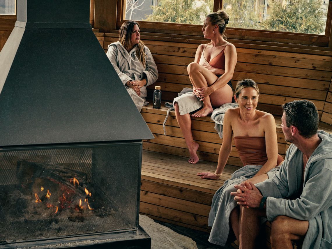 guests around a fireplace at the spa