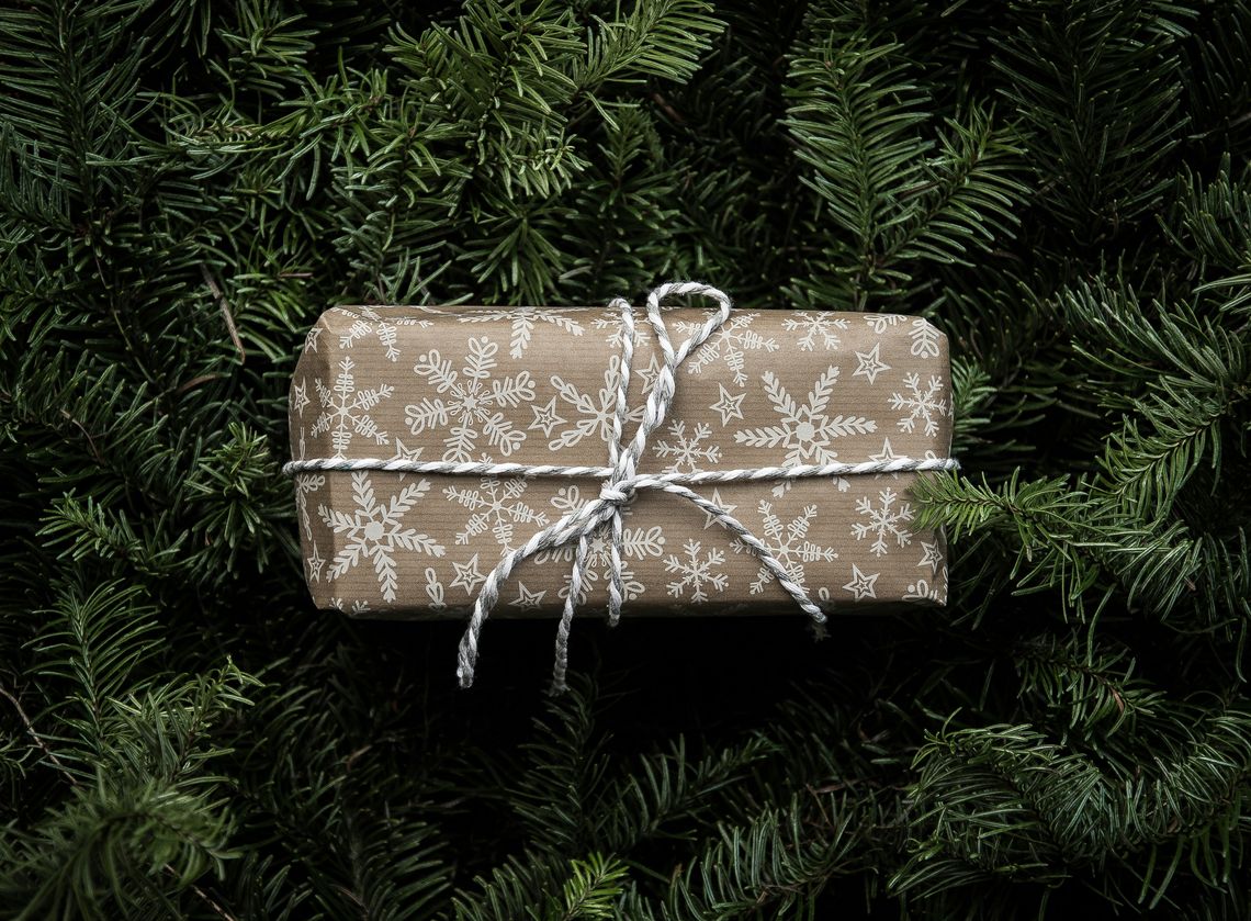 wrapped gift on pine branches