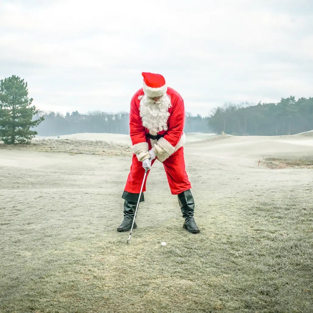 Santa playing golf