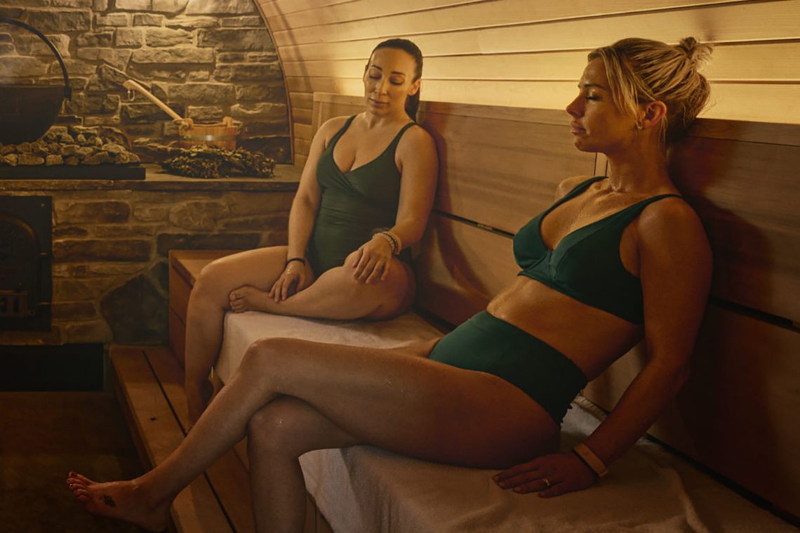 guests relaxing in a sauna