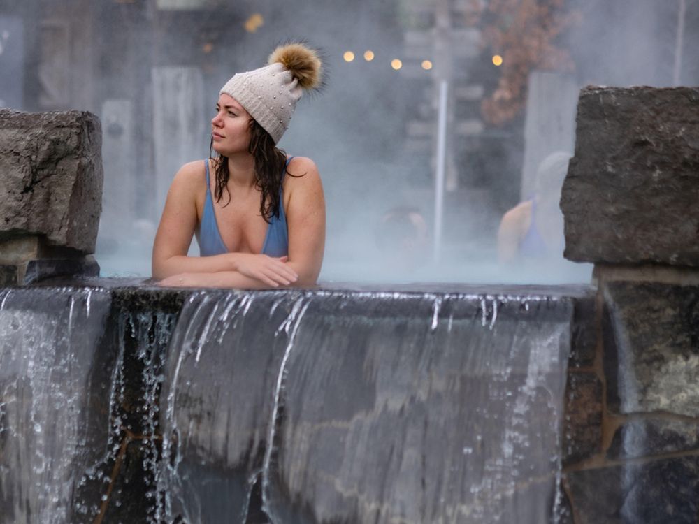 woman relaxing in a hot thermal bath