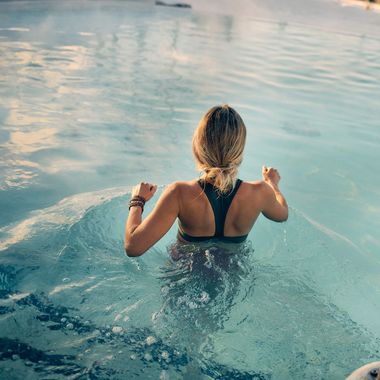 woman entering a thermal bath
