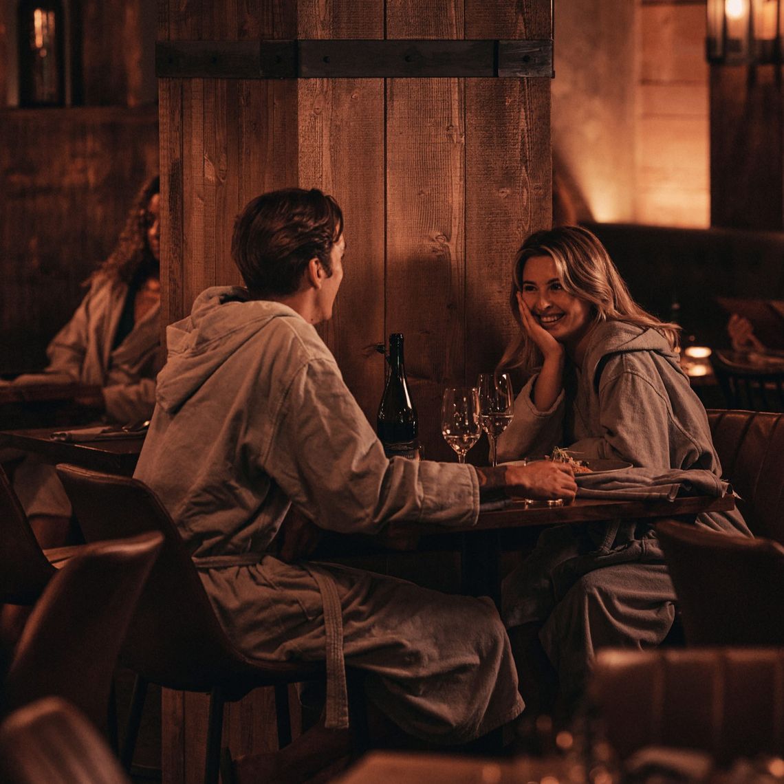 couple gazing into each others eyes in the resto