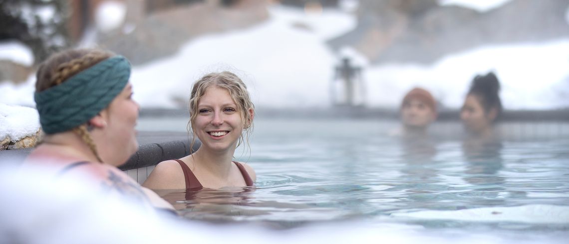 guests enjoying outdoor thermal baths