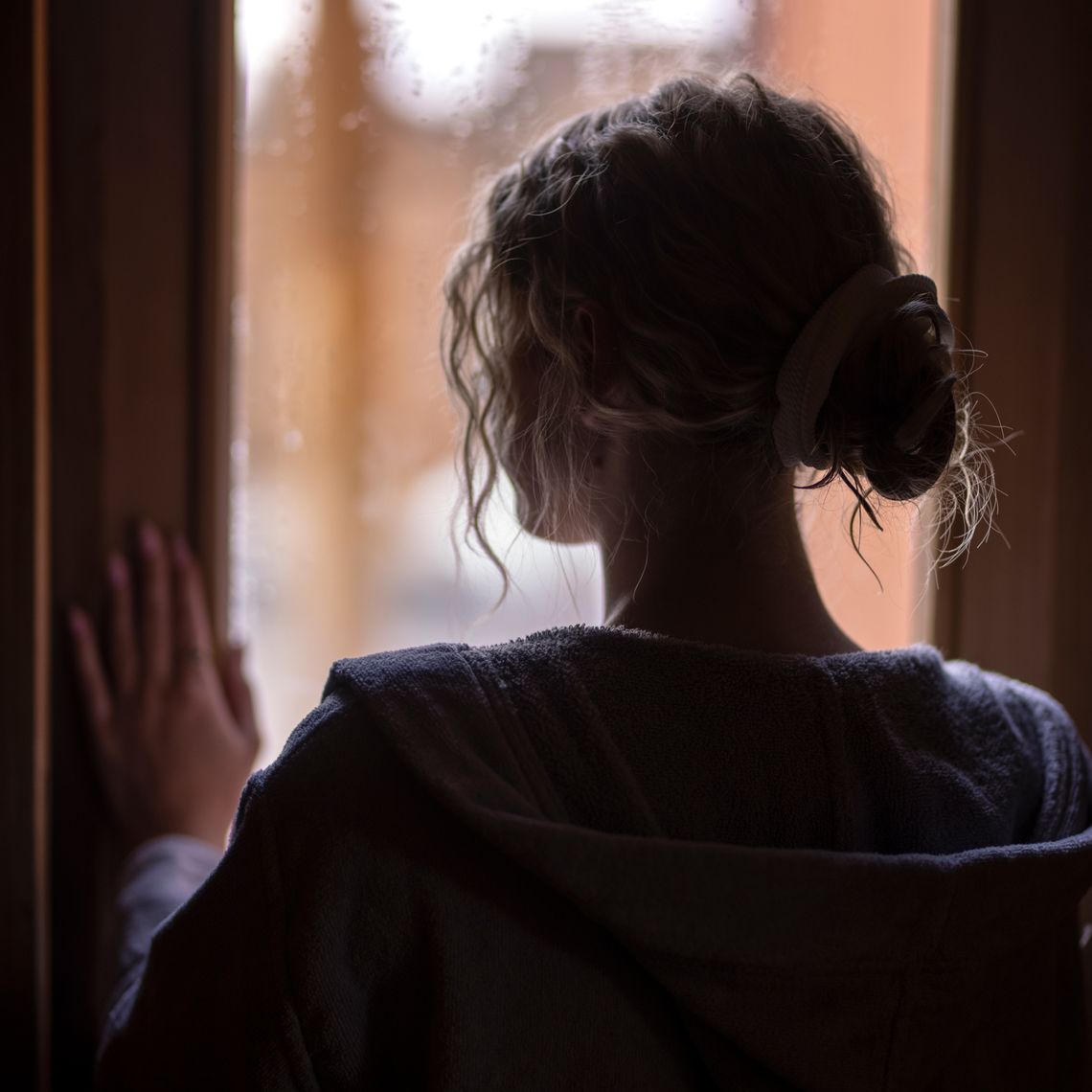 guest in a sauna looking out