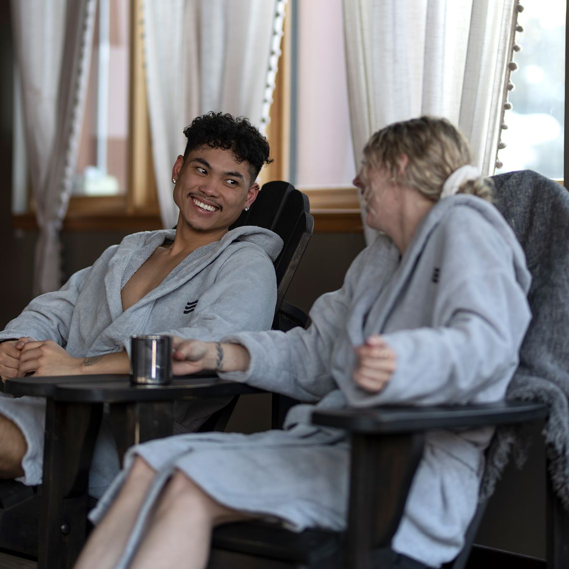 guests laughing in an indoor relaxation area