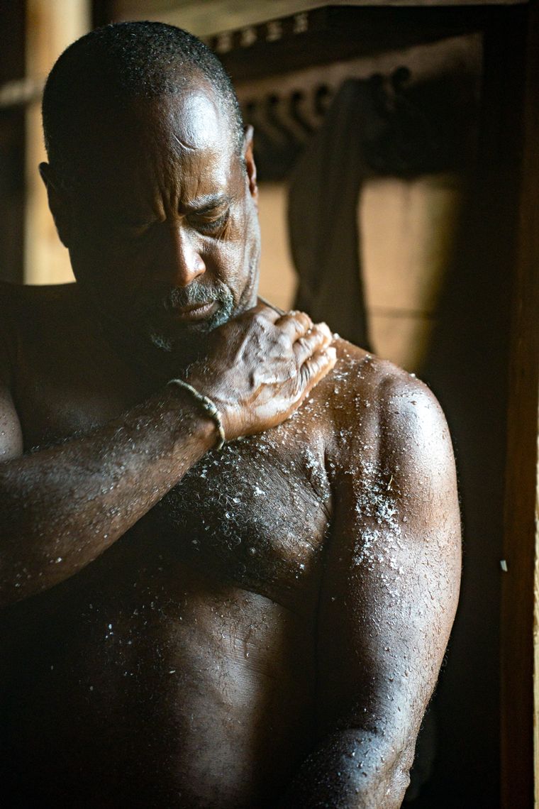 man exfoliating with salt