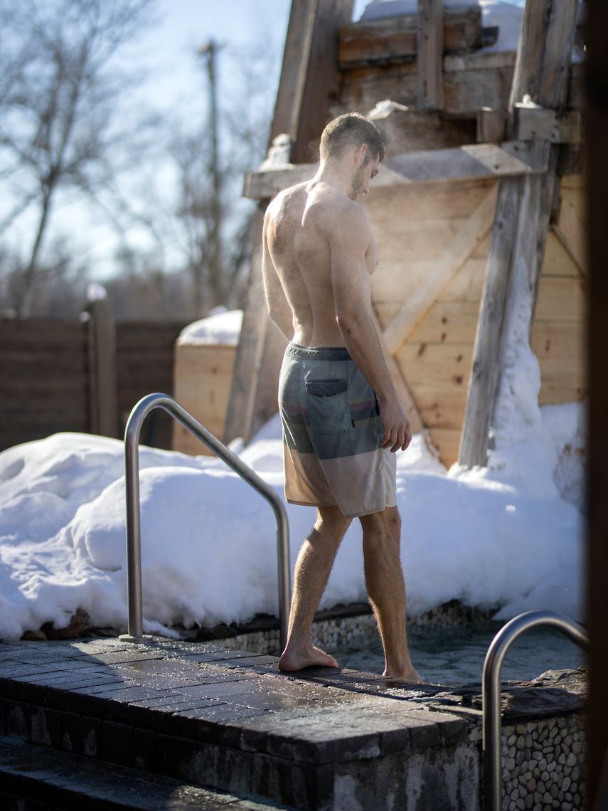 man entering a cold bath