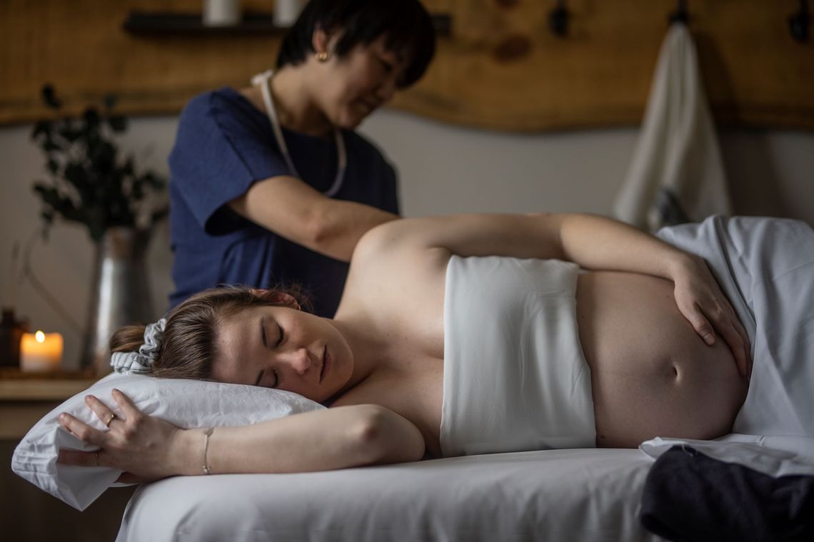 woman enjoying a mom-to-be massage