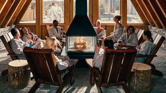 guests sitting around a fireplace