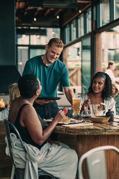 artisan serving drinks to guests