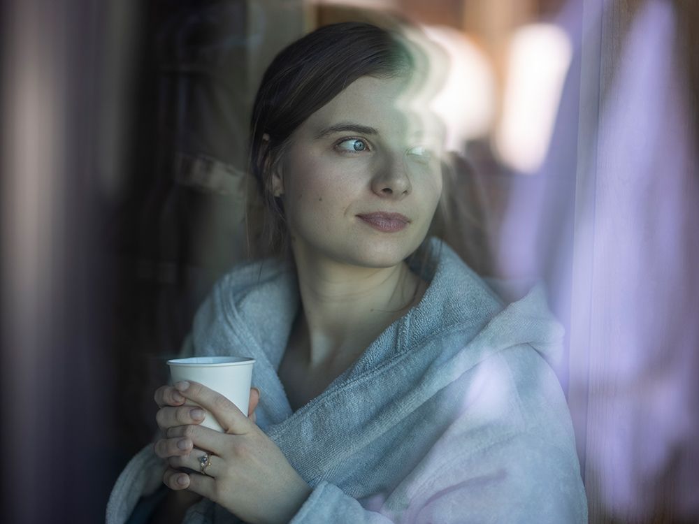 woman looking out of a window