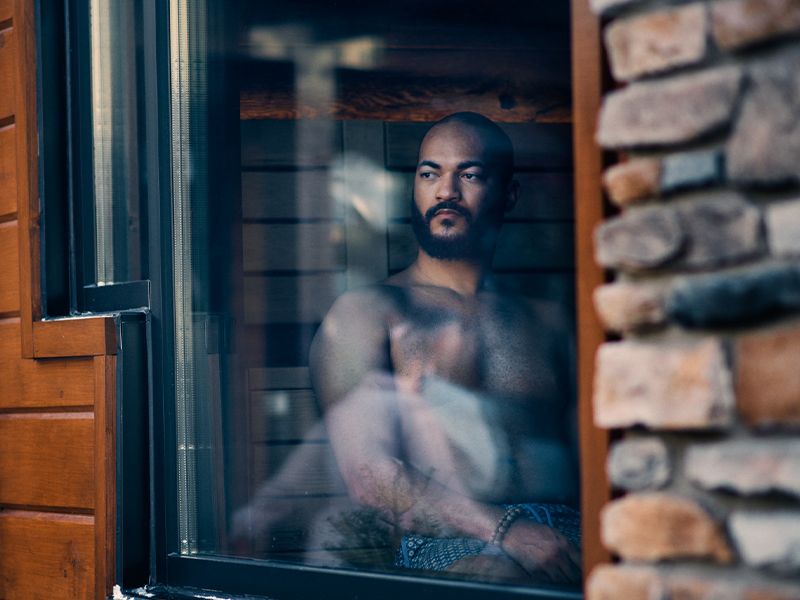 guest looking out of a sauna